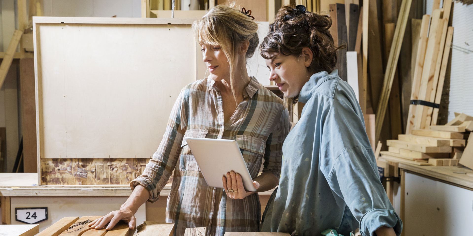 Two female carpenters planning